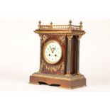 19th century French bronzed and gilt metal mantel clock, white enamelled dial. Decorated with