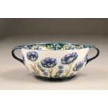 Macintyre Florianware bowl, circular with two looped handles, decorated with poppy design in blue