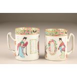 Pair 19th century Canton tankards, with double twist handles and decorated with Chinese script and