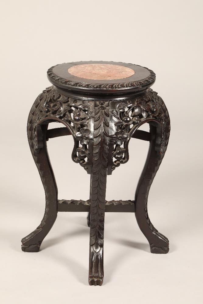 Chinese hardwood jardinière stand, rouge marble insert, carved and pierced floral and fruit apron