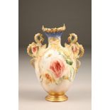 Nautilus porcelain vase, twin dragon handles, hand painted with roses, 23cm high.