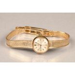 Ladies 9 carat gold Omega wrist watch with original 9 carat gold bracelet strap, champagne dial with