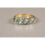 18 carat gold diamond and green gemstones ring, five baguette cut interspersed between pairs of