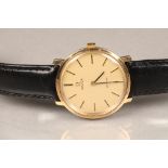 Gents 9 carat gold Omega de Ville wrist watch, champagne dial with hour markers, with replacement