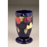 Moorcroft pottery vase, decorated in Wisteria Plum, signed and incised factory mark to base, 23cm