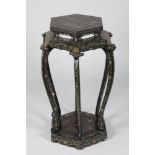 Chinese black lacquer jardinière stand, with gilt chinoiserie decoration, hexagonal top supported on