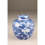 19th century Chinese blue and white vase and cover decorated with flowering prunus, four character