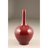 Early 20th century flambe vase, of bottle form, rich raspberry hue, four character mark to base,