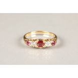 Victorian unmarked yellow gold diamond and ruby ring, three round rubies with two set diamonds, ring