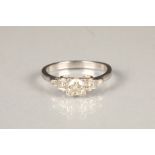 Ladies platinum diamond ring, central stone, 0.5 carats flanked by two graduated diamonds at