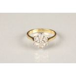 Ladies 18 carat gold diamond cluster ring, daisy form, seven brilliant cut diamonds, total diamond