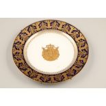 Sevres wall plate, blue bordered porcelain plate with rich gilt decoration and a central gilt coat