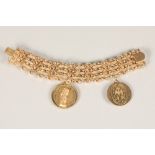 Ladies broad link 14k gold bracelet, with two 14k gold medallions, 18cm long, 2.5cm wide, weight