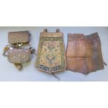 A LARGE NORTH AFRICAN LEATHER SADDLE POUCH AND TWO SMALLER POUCHES, 19TH CENTURY, ALGERIA OR MOROCCO