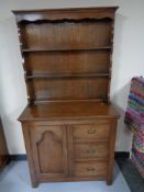 An Edwardian oak welsh dresser , width 91 cm.