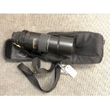 A Nikon AF-S Nikkor 300 mm 1:4 D telephoto zoom lens, with lens hood, with bracket,