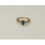 A 10ct yellow gold emerald and diamond ring, approximately 0.25ct emerald, size M.