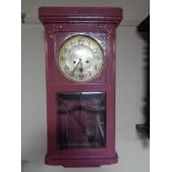 An early twentieth century painted wall clock with silvered dial,