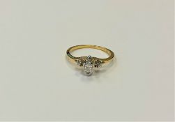 A 14ct yellow gold marquise and round cut diamond ring, the central stone approximately 0.