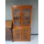 A Yewwood double door display cabinet top and a non-matching double door cupboard (2)