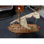 A wooden masted boat on stand CONDITION REPORT: height 48 cm length 57 cm width 18