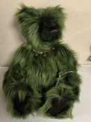 A Charlie Bear, green teddy bear.