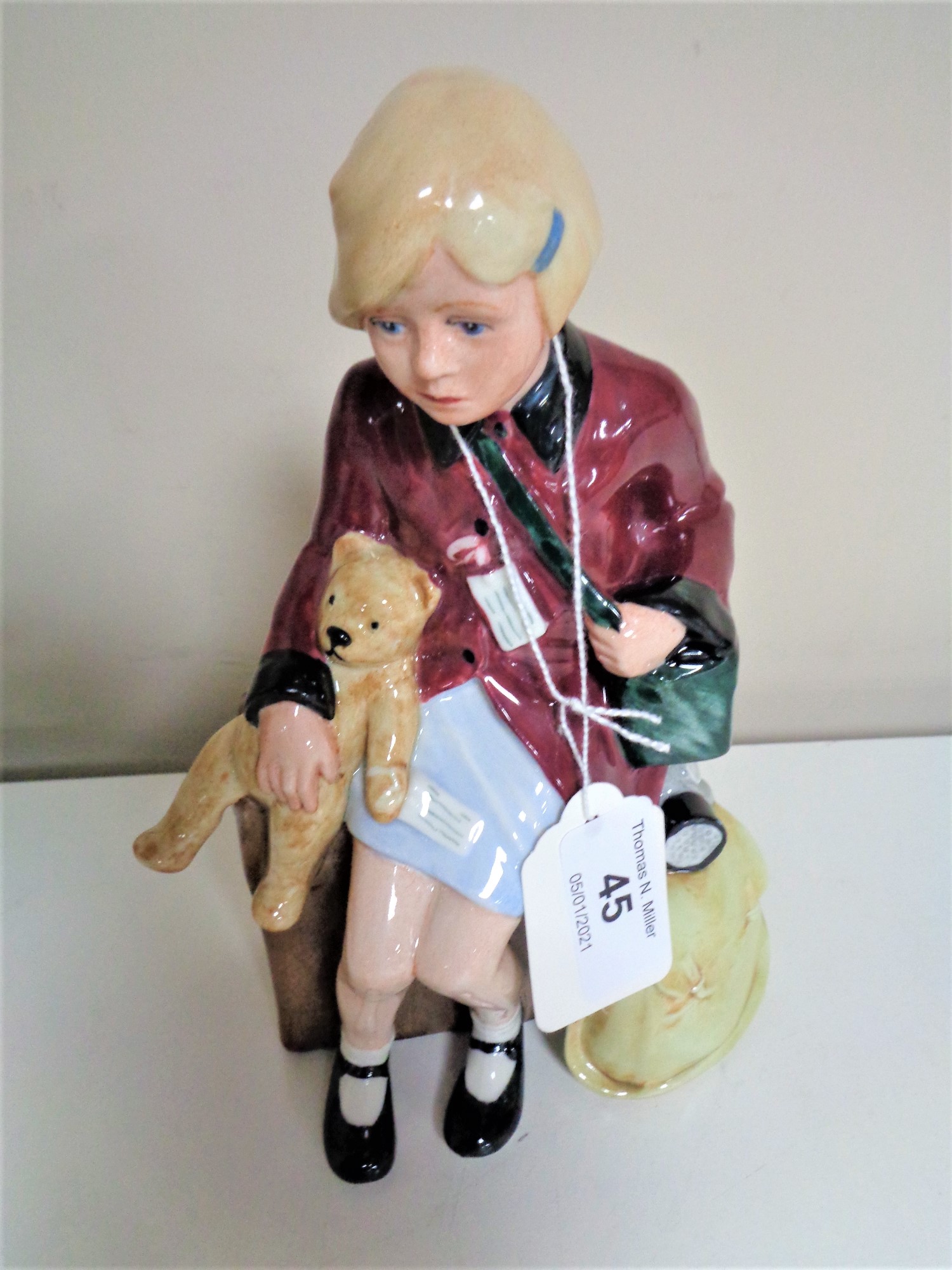 A Royal Doulton figure, The Girl Evacuee, HN 2023.