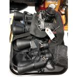 A tray of two pairs of binoculars,