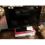 A Samsung 32 inch LCD TV with remote together with a boxed LG digital TV recorder