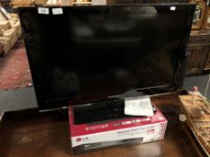 A Samsung 32 inch LCD TV with remote together with a boxed LG digital TV recorder