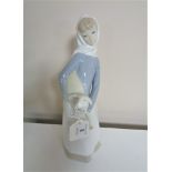 A Lladro figure, girl with a lamb.