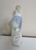 A Lladro figure, girl with a lamb.