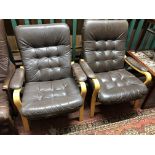 A pair of brown buttoned leather beech framed armchairs CONDITION REPORT: Width 72