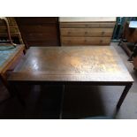 A contemporary copper effect map table