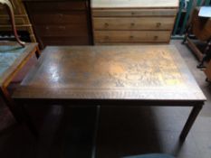 A contemporary copper effect map table