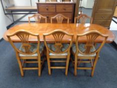 An inlaid yewwood extending dining table and set of six chairs CONDITION REPORT: