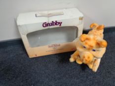A Worlds of Wonders Teddy Ruxpin figure, circa 1980's depicting Grubby, part boxed.