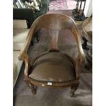 An early twentieth century oak armchair