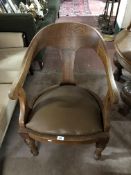 An early twentieth century oak armchair