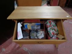 A light oak storage sewing table