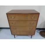 A mid century teak four drawer chest CONDITION REPORT: 93 cm x 76 cm x 46 cm.