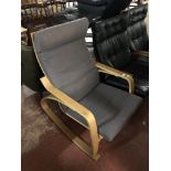 A mid century oak framed relaxer chair