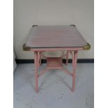 A pink loom glass topped occasional table