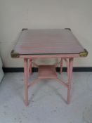 A pink loom glass topped occasional table