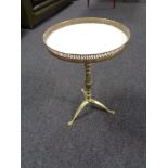 A brass wine table with gallery