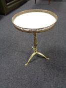 A brass wine table with gallery
