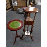 A reproduction mahogany wig stand fitted with two drawers and a leather topped wine table