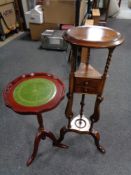 A reproduction mahogany wig stand fitted with two drawers and a leather topped wine table