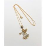 A yellow two-tone gold pedant modelled as an angel on chain