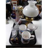 A tray of brass and glass oil lamp, Royal Airforce commemorative tankards,